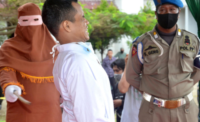 Indonesian Man Collapses During Flogging for Child Rape by Raphael Bichene