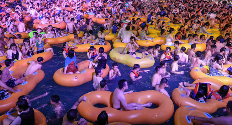 China Defends Wuhan Pool Party After Global Outrage by Francisca Ogar