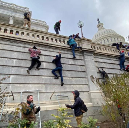 Mob Breach US Capitol in Pro-Trump Protests by Raphael Bichene