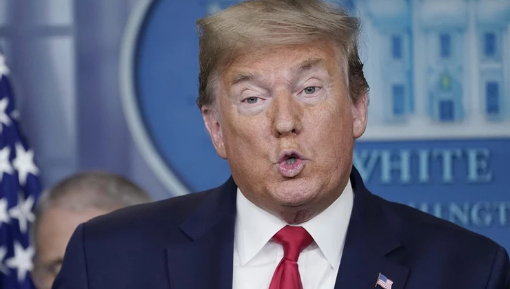 Trump Defends Support for Disproved Covid-19 Treatment by Raphael Bichene